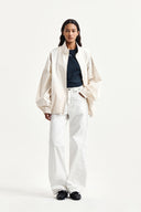 BACK LOGO HIGH NECK JUMPER IN CREAM image 10
