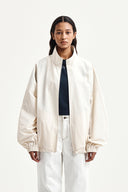 BACK LOGO HIGH NECK JUMPER IN CREAM image 19
