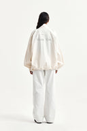 BACK LOGO HIGH NECK JUMPER IN CREAM image 9