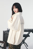BACK LOGO HIGH NECK JUMPER IN CREAM image 12