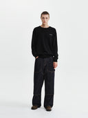 CALLIGRAPHY BACK LOGO KNIT PULLOVER IN BLACK